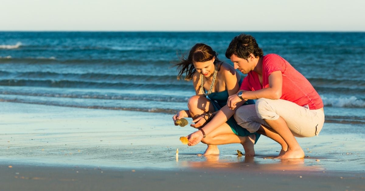 couple looking for shells