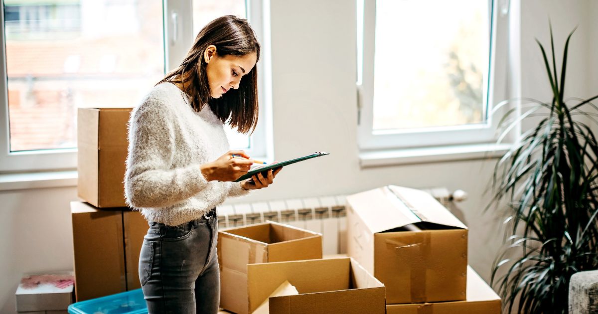 Person checking moving checklist