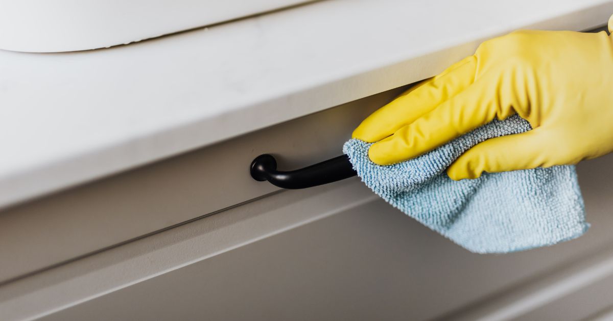 Person cleaning a drawer - MyStackBox Person cleaning a drawer